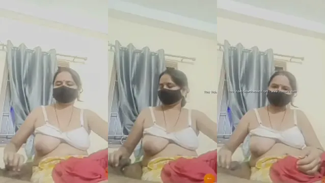 Desi Bhabhi Giving a Steamy Handjob in the Bedroom