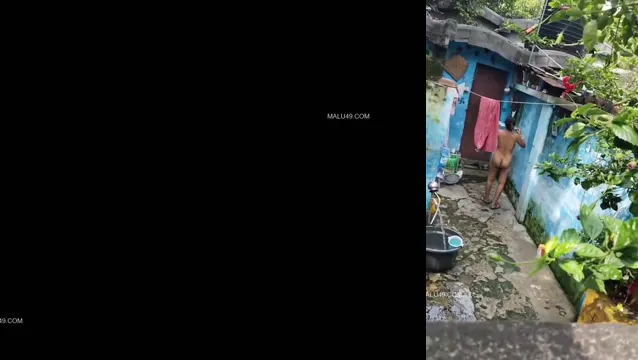 Desi Village MILF Bhabhi Caught Bathing in Open Compound