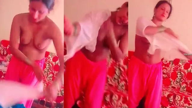 Desi-Frau zieht sich langsam im Schlafzimmer an und zeigt große Brüste